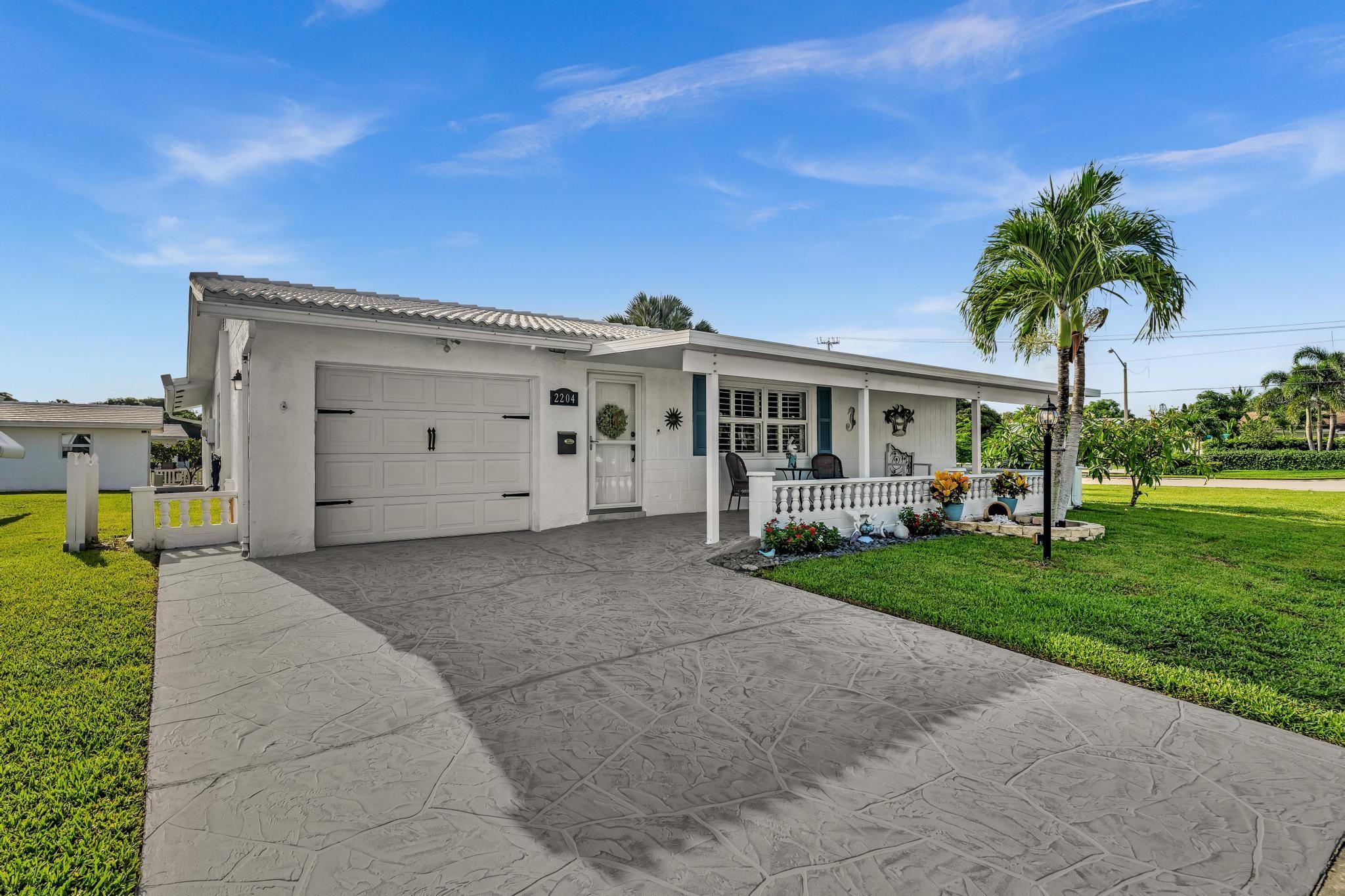 Welcome to this meticulously renovated 2BR/2BA home on a spacious corner lot in desirable Leisureville. Expanded Challenger model is 1,624 sq ft of beautifully updated living space w/ modern finishes. Elegant tile flooring, impact windows, and a bright open-concept is perfect for entertaining. The heart of the home is the stunning, fully renovated kitchen, w/ SS appliances, ample counter space, and stylish cabinetry. Bathrooms have been tastefully updated. The extended master BR is a standout feature w/ more space than other Challengers. Lush landscaping adds charm to this perfect property. Low HOA fee includes a clubhouse, fitness center, pool, billiard room, and more. Located near restaurants, hospitals, and major highways, this home offers both luxury and practicality.