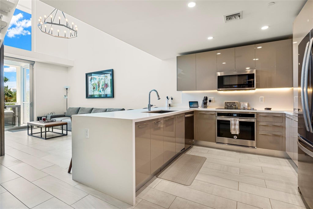 Photo of 2000 METROPICA Way #216, Sunrise, FL 33323 (MLS # B26059653)