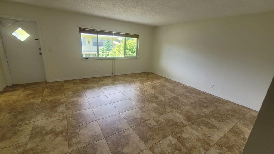 Welcome to downtown Lake Worth Beach This beautiful apartment is located walking distance from the downtown street and less than 1 mile to Lake Worth Beach. Beautiful courtyard is perfect for your morning coffee. This unit has been beautifully updated flooring, new stove, countertops and freshly painted! This unit has a unique extra space with a walk-in closet, a bathtub/shower combo. Coin operated washer and dryer on premises! Walk to the beach and come check Lake Worth living is all about!