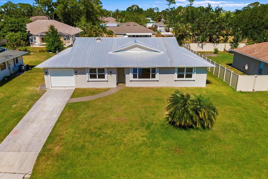 Photo of 1457 SE Barker Lane, Port Saint Lucie, FL 34983 (MLS # R10986040)