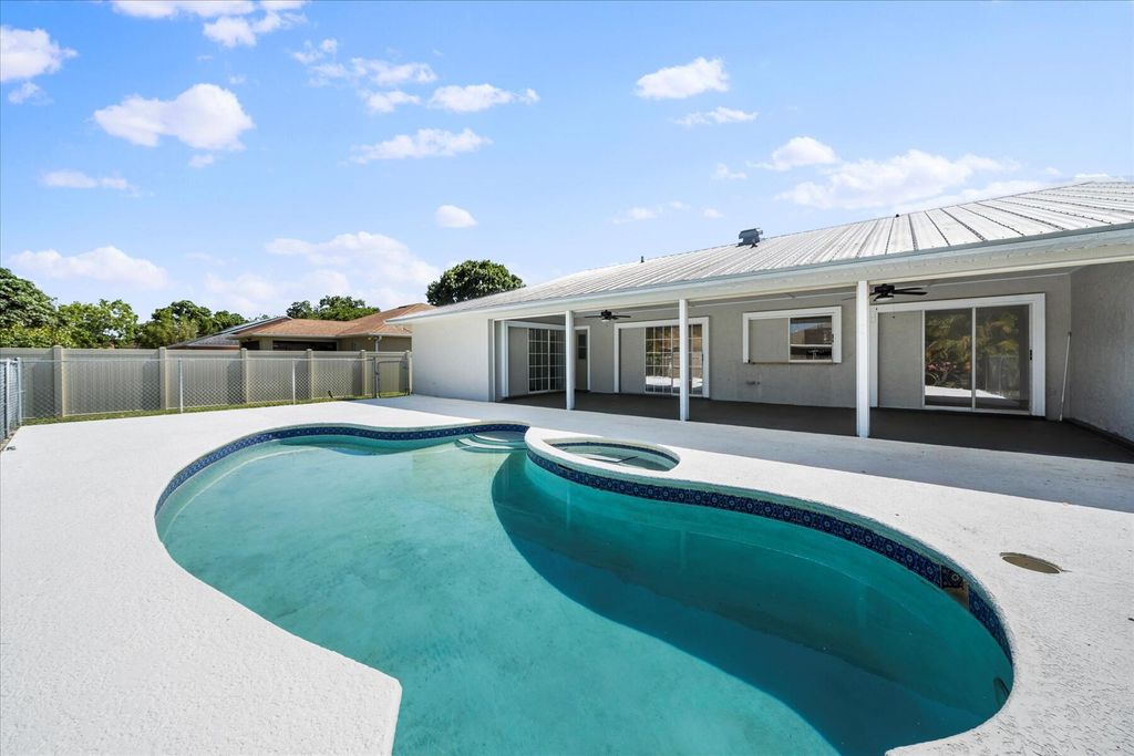 Photo of 1457 SE Barker Lane, Port Saint Lucie, FL 34983 (MLS # R10986040)