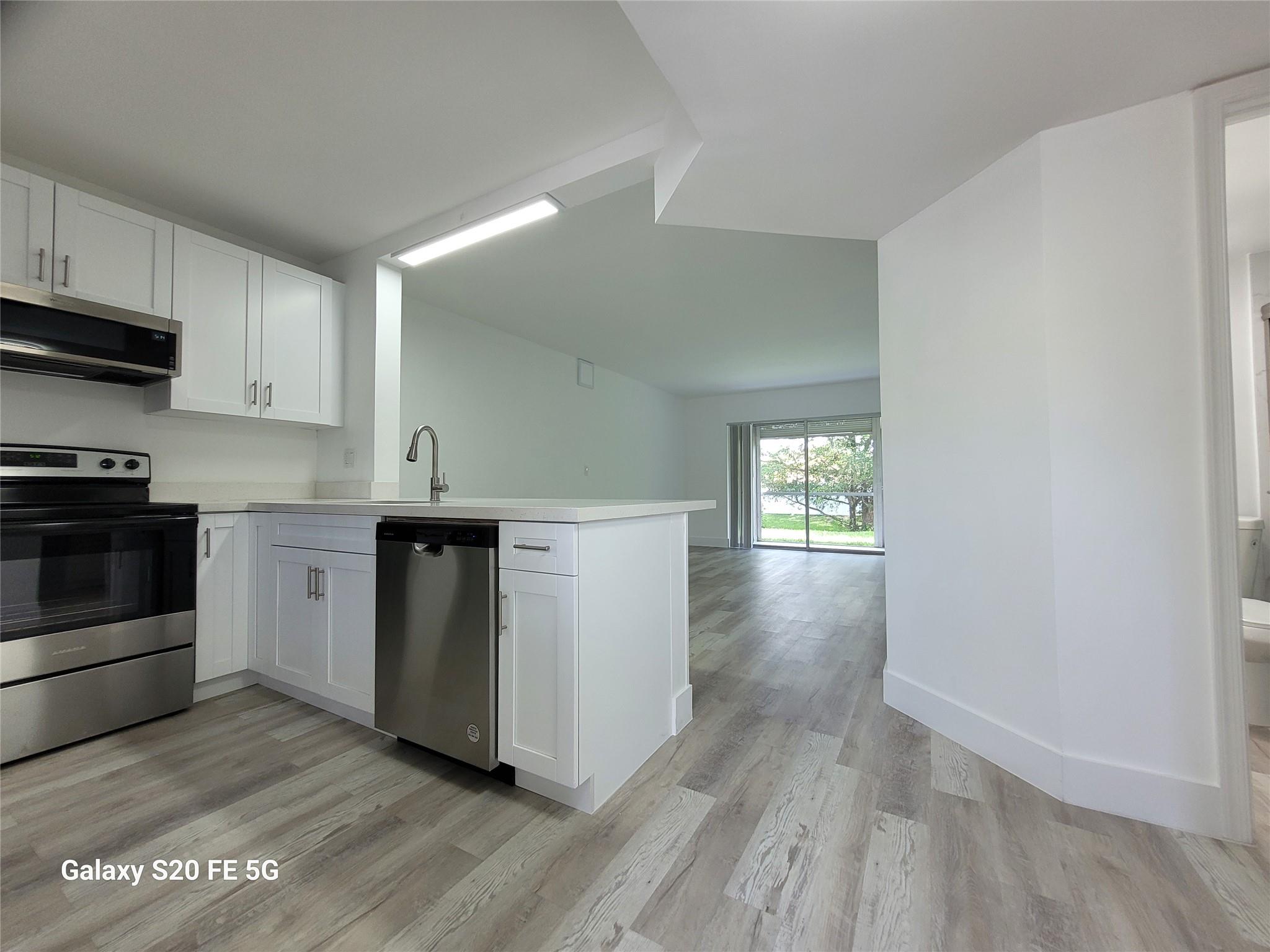 CORAL SPRINGS: 2-bedroom, 2 full bath remodeled unit. All new kitchen, floors, appliances, and bathrooms. First floor unit with screened patio and storage. Water view on tranquil canal. Enjoy your spare time in the backyard under tree shadows, perhaps with a barbeque and a glass of wine.