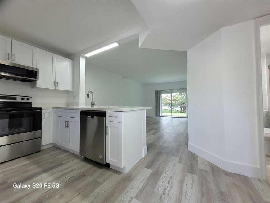 CORAL SPRINGS: 2-bedroom, 2 full bath remodeled unit. All new kitchen, floors, appliances, and bathrooms. First floor unit with screened patio and storage. Water view on tranquil canal. Enjoy your spare time in the backyard under tree shadows, perhaps with a barbeque and a glass of wine.