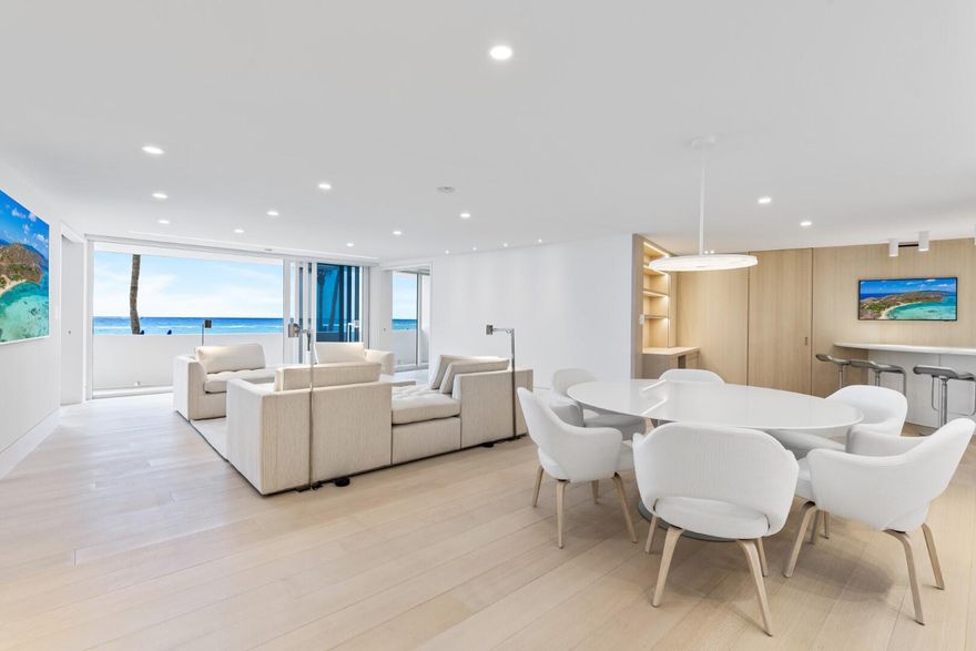 Gorgeously remodeled 2BR/2.1BA Oceanfront Condominium in the sought-after Sun and Surf. Stunning oak wood flooring and impact glass throughout. Great room features beautiful ocean views, motorized blackout and sunshades, and hidden art hanging tracks. Beautiful kitchen with marble countertops and backsplash, and Subzero, Miele, and Wolf appliances. Custom cabinetry, breakfast bar, and office with convertible desk. Waterfront Owner's Suite with custom riffed oak paneling, custom desk, and extra storage in king-size bedframe. Guest Suite features king-size Murphy bed, ocean views, and custom vanity and shower. Additional highlights include hidden door accessed laundry area with custom cabinetry, hidden door accessed wet bar and storage, pocket door accessed custom bookshelf, and stunning marble-walled powder room. The Sun and Surf is a fabulous, full service building with valet, swimming pool, exercise room, full time management, and beach access.