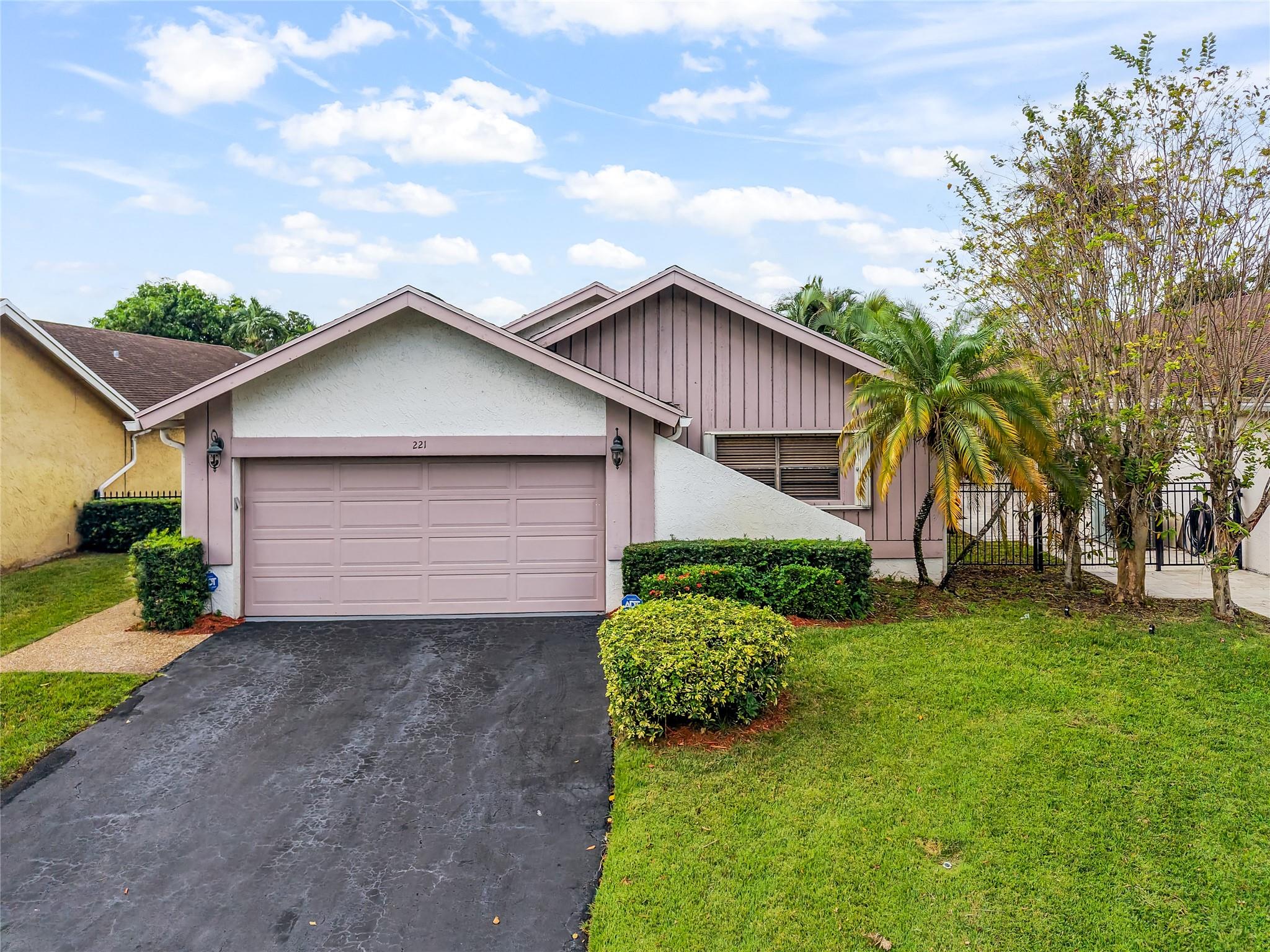 Price Improvement! Nestled in the tranquil community of Las Brisas in Central Plantation, this immaculately maintained home boasts three bedrooms, two bathrooms, and a two-car garage. The open floor plan includes a spacious, well-lit sunroom offering stunning views of the prestigious demi private Jacaranda Golf Course. The kitchen is outfitted with wooden cabinets and Corian countertops, providing ample space for culinary endeavors. The large master bedroom features an en-suite shower and a walk-in closet. A fenced yard with a side entry door, hurricane protection for all windows, lawn and access to the community pool contribute to the effortless lifestyle this home affords. No golf fees in HOA, just views!!
Visit today to experience it for yourself!