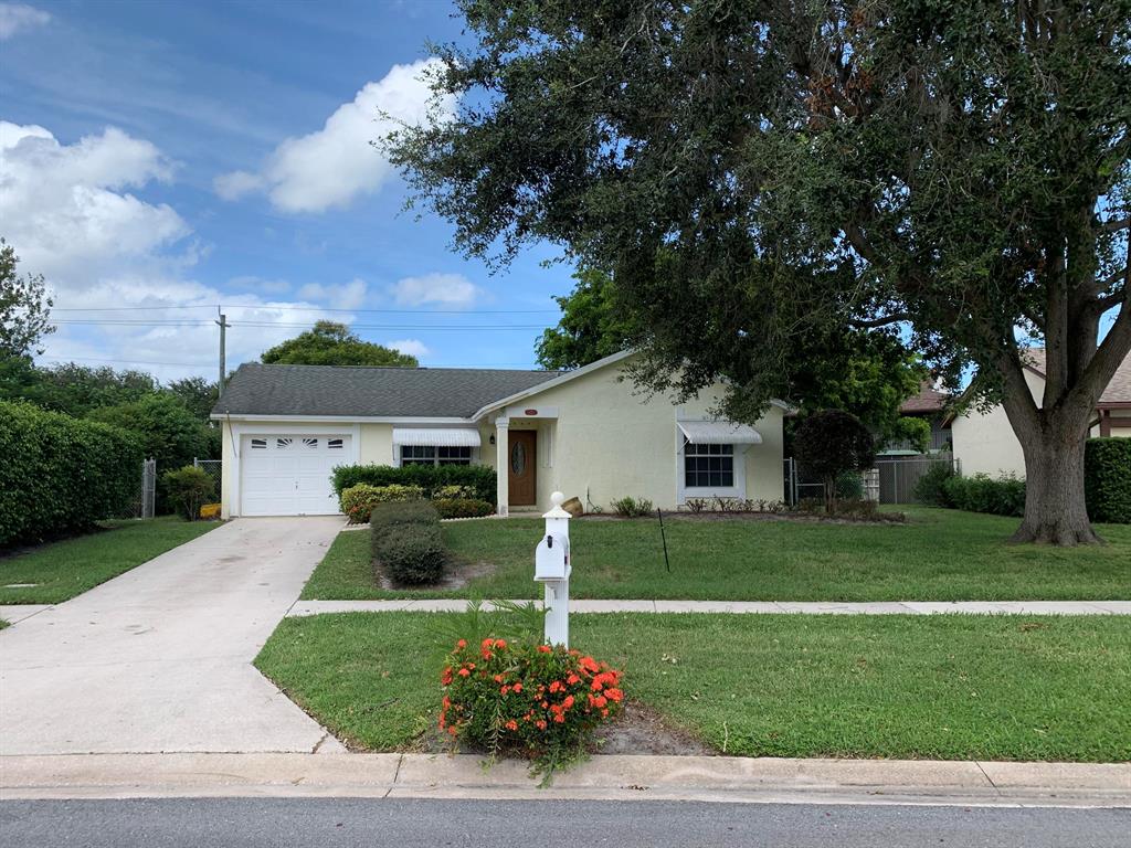 Amazing 3 bedroom 2 bath 1 car single family home in the heart of Jupiter. Fenced back yard new vinyl wood laminate flooring throughout. Freshly painted inside and out. Lovely private back yard fenced in .New Hurricane shutters are on order, Excellent condition.Community Pool!!