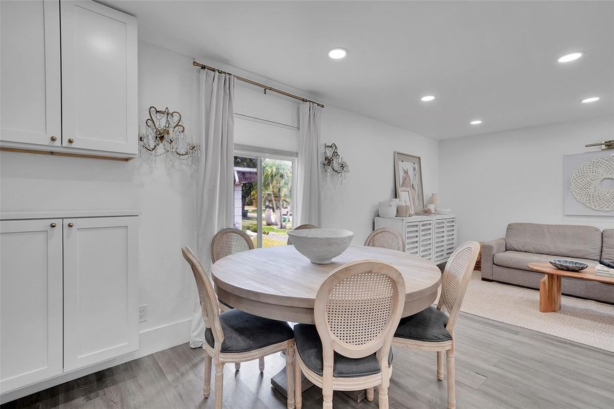 Modern charm meets family-friendly living in this beautifully updated 3BD/2BA home, featuring designer finishes and a light-filled open layout. The stunning kitchen boasts a quartz waterfall island, glass-front cabinetry, and stainless steel appliances. Enjoy upgraded bathrooms, luxury vinyl plank flooring, and thoughtful upgrades throughout. Step outside to a private, fenced backyard with mature trees, a pergola-covered patio, above-ground saltwater pool, playset, orchid trees, mango, and avocado trees. Roof 2022. Located near A-rated schools, parks, houses of worship, and the beach—this turnkey gem offers comfort, style, and convenience. Enjoy community amenities with the very low HOA of just $12/m.