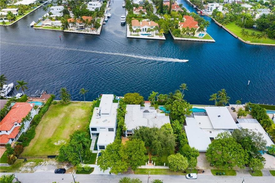 Extremely rare opportunity to own a 15,300 +/- SqFt lot with 100 +/- ft Directly on the New River in the prestigious Rio Vista neighborhood. Situated on this lot is a lovely, old florida style 5BR | 4.5 Bath| 2 Car residence with wood floors, crown molding, fireplace, family room and formal living and dining rooms. The kitchen overlooks the intracoastal and has informal dining, an island with counter seating, a walk-in pantry and Thermador gas range, double ovens, warming drawer, Sub-Zero refrigerator and freezer. It has an oversized master bedroom with sitting area, walk-in closets, large master bath with water closet and balcony overlooking the lush mature landscaping, New River and downtown.