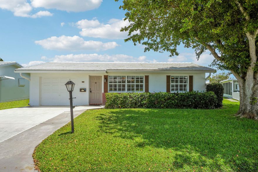 Beautifully updated 2BR/2BA home with den in the highly desirable 55+ community of Palm Beach Leisureville! This charming residence features full impact windows, crown molding, an air-conditioned laundry room, extra freezer, and a bright spacious layout filled with natural light. The den is perfect for a home office, guest space, or additional sitting area. Enjoy relaxing or entertaining on the private back patio. Full ADT alarm service is already in place for the new owner. Low HOA fee of only $180/month includes golf course access, 3 clubhouses, pools, fitness amenities, and an active social lifestyle. Ideally located just 10 minutes from the beach and near Boynton Beach's best restaurants, shopping, and nightlife.