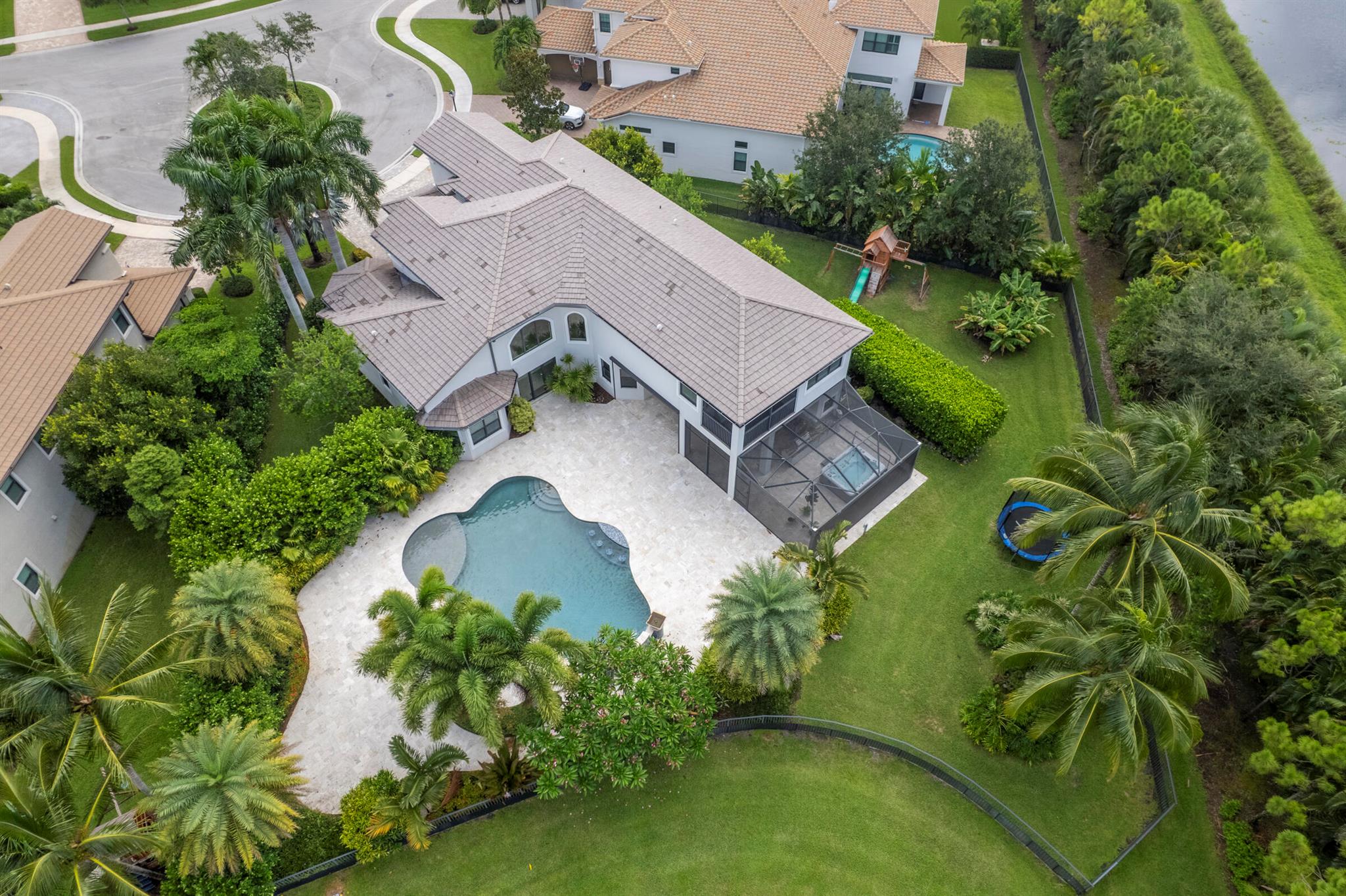 Welcome to one of the most exceptional and private properties in prestigious Seven Bridges. Situated on a rare and expansive 1/2-acre lot, this estate offers unparalleled space, serenity, and sophistication--perfect for families, pets, and those who love to entertain. Inside, soaring ceilings and natural light enhance the open layout. The chef's kitchen features high-end appliances and a walk-in pantry. The primary suite includes dual baths, a sitting room, two walk-in closets, and a secluded screened balcony. Upstairs offers a loft, study area, and two ensuite bedrooms. Two additional guest bedrooms and theater are located on the main floor. This residence is equipped with a Control4 system for the lights and audio. A rare opportunity in a prime location with countless upgrades.