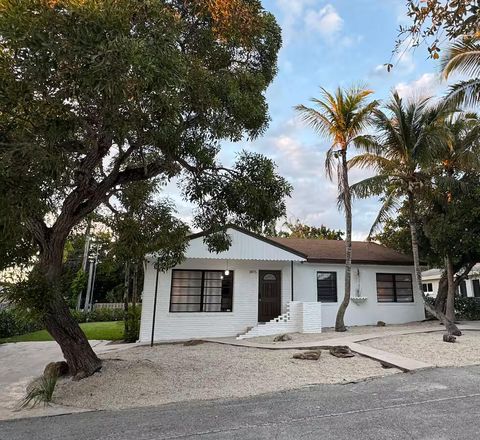 Photo of 1875 Ridge Road, Juno Beach, FL 33408 (MLS # B26042805)