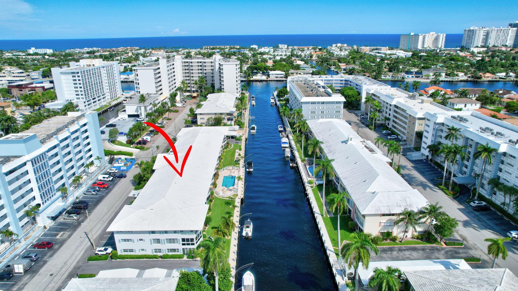 This boutique waterfront condo boasts 400 feet of brand new concrete docks, ideal for your yacht! Enjoy the Travertine pool deck and patios (2023) and take in the peaceful waterfront views from a wall of windows overlooking the docks and the pool. Dock your boat right outside your window! Inside, the updated kitchen, new porcelain tile flooring, and a new built-in bar with ice-maker and wine fridge add a touch of luxury. Conveniently located near top restaurants, shopping, and the beach. Close to Coral Ridge Country Club! Low HOA dues, on-site management, and recent improvements like exterior painting (2024) and a new security system (2023) make this a meticulously cared for property! Make it yours today!