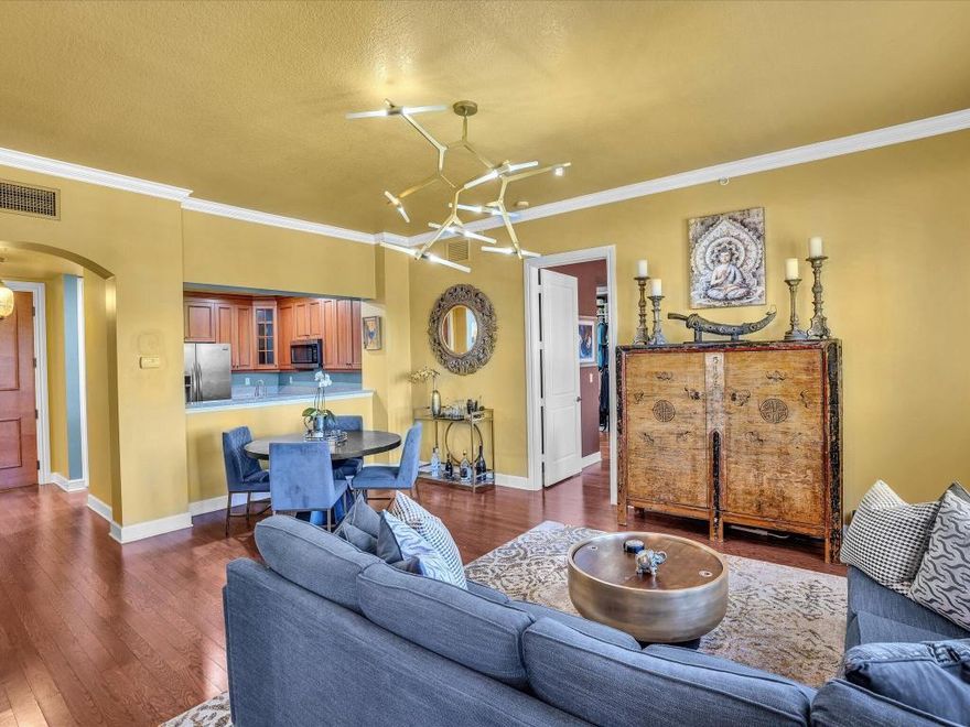 Located in a prime location just 2 blocks North of Atlantic Ave is the Crown Jewel of Downtown Delray. Welcome to City Walk at Pineapple Grove.  Just a few steps outside the front entrance of this luxurious building places you into the heart of everything that ''The Avenue'' has to offer.  Shopping, entertainment, dining and nightlife.  Its all right here.  The 2-bedroom, 2-1/2 bath (plus den/office) split plan unit boasts 1,531 sq. ft of opulent living.  The kitchen features a large pantry, wood cabinetry, granite counters and a full host of stainless appliances. A large primary suite offers 2  walk-in closets with custom built-in's and an expansive bathroom with dual vanities, separate shower and soaking tub. The spacious ensuite guest bedroom is equipped with a huge walk-In closet with custom built-ins. This beautiful condominium is completed with a centrally located Living Room & Dining Room with custom Millwork/Crown Moldings and Window Treatments throughout!