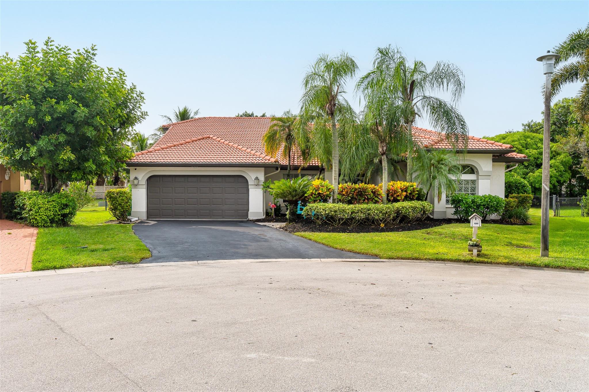 North Springs - No HOA Here! Currently Zoned Stoneman Douglas HS. This Spectacular 4 Bed, 3 Full Bath, Pool Home Sits On A Double Lot Fenced Backyard & Perfectly Nestled In The Cul-De-Sac. The Floorplan Is A Magnificent Triple Split Layout Affording Occupants A Sense Of Personal Privacy. The Crown Jewel Is The Primary Suite/Wing of The Home. Step Inside The Double Doors To A Private Foyer, You'll Find Two Generously Sized Walk-In Closets, A Primary Bathrm That Can Double As A Secret Hide Away & Then Of Course The Bedrm Itself Is Grandiose In Size & Boasts Spectacular Views Of The Pool & Park Like Backyard. For Garage Enthusiasts You Can Chill Out In The Air Conditioned Two Car Garage while admiring the epoxied floors. There's A Dedicated Air Conditioned Laundry Rm So Laundry Is No Sweat!