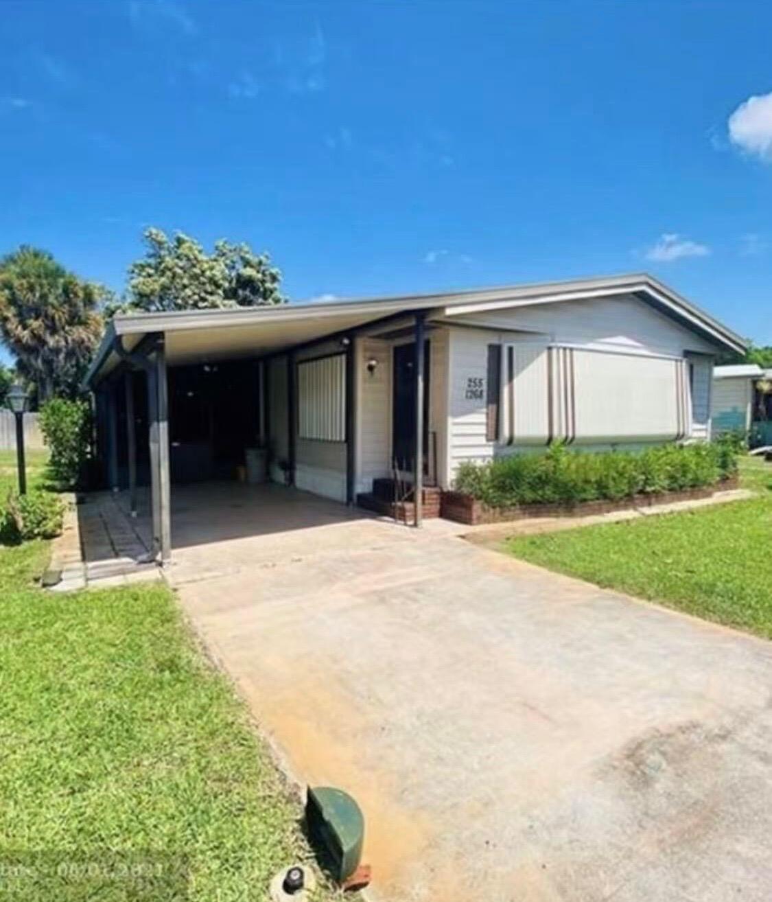 SPACIOUS AND BEAUTIFUL DOUBLE-WIDE MOBILE HOME ON THE LARGEST LOT IN PALM BEACH COLONY. IT FEATURES TWO LARGE BEDROOMS, AN OPEN KITCHEN WITH AN ISLAND, AND TWO BIG LIVING ROOMS. THERE'S ALSO AN AIR-CONDITIONED FRONT PORCH AND A UTILITY ROOM WITH A WASHER AND DRYER. THE EXTRA-LARGE LOT PROVIDES MORE YARD SPACE AND PRIVACY. CONVENIENTLY LOCATED NEAR THE AIRPORT, BEACHES, AND DOWNTOWN, PALM BEACH COLONY IS A FRIENDLY AND QUIET COMMUNITY THAT FEELS LIKE A WORLD OF ITS OWN.