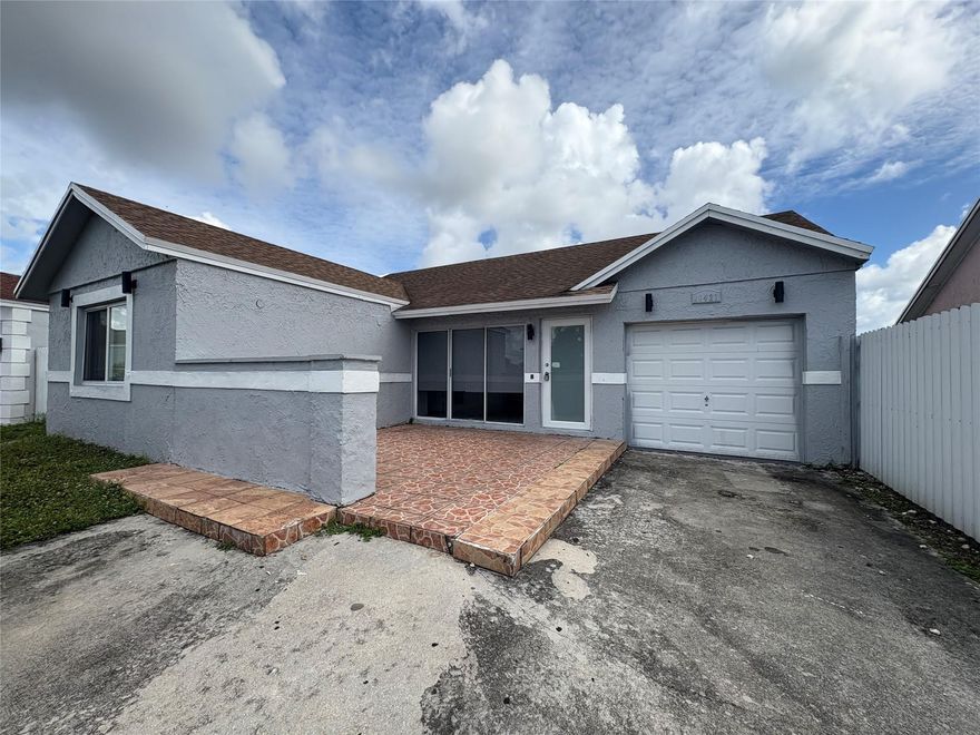 Spacious 3-bedroom, 2-bath home with a garage located in the heart of Miami Gardens. Just minutes from Hard Rock Stadium, the Florida Turnpike, shopping, dining, and more. This home offers tile flooring throughout, a modern kitchen with stainless steel appliances, central A/C, ample driveway parking, and a fully fenced backyard perfect for relaxing or entertaining.