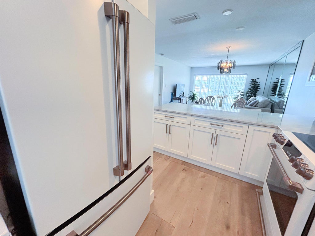 Photo of 1030 SILK OAK Terrace #203, Delray Beach, FL 33445 (MLS # B26070883)