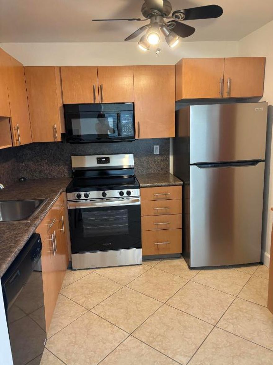 RENT IMMEDIATELY - PERFECT OPPORTUNITY FOR INVESTORS! One of the few remaining ''rent right away bldgs''! Nicely remodeled, much sought after, first floor unit in fully funded bldg.  Lovely tenant in place for the next year.  $1550/mo.
The condo boasts a remodeled kitchen with a new stove and newer appliances.  The condo has tile throughout and new LVP in the bedroom and guest bath.  The remodeled primary bathroom has a walk in shower.  The screened in patio houses a newer full size washer and dryer with extra storage.  Patio has roll down storm shutters.  There are newer blinds and verticals throughout.  New led lighting in both bathrooms. Parking spot is conveniently located a few steps from the unit.