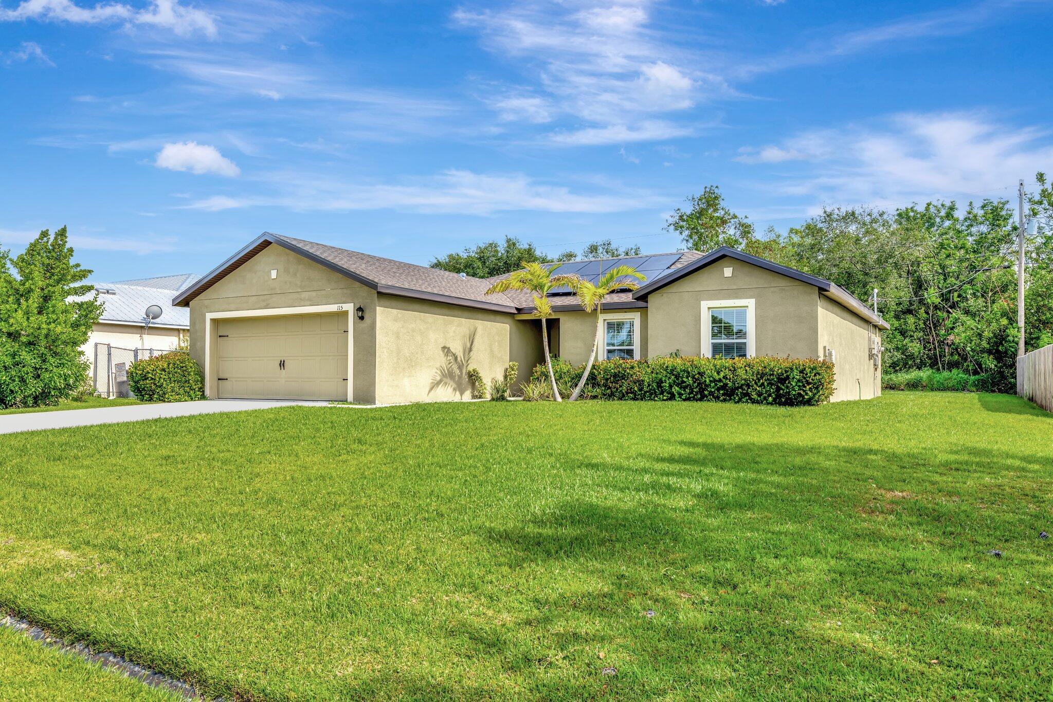 Welcome to 115 SW South Wakefield Circle! Built in 2022, this beautifully maintained home features 3 bedrooms, a versatile den, and 2 full bathrooms. The open layout is perfect for modern living, with granite countertops and vaulted ceilings. Enjoy cooking and entertaining in the spacious kitchen that flows into the main living area. Step outside to a huge backyard with plenty of space to build your dream pool or outdoor oasis. Located in a growing area of Port St. Lucie with no HOA, this home is move-in ready and packed with potential