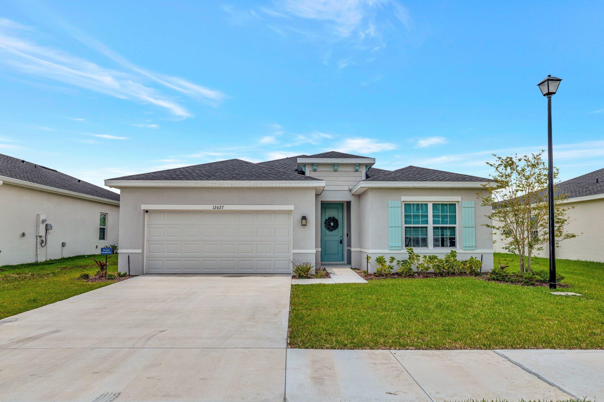 Welcome to Central Park--just 15 minutes to beautiful beaches and close to top golf courses, shopping, and dining. This vibrant community offers 10 acres of resort-style amenities including a pool, splash park, cabana, snack bar, walking trails, dog park, and sports courts for pickleball, tennis, and basketball. The Adeline model features 3 bedrooms, 2 baths, and a desirable split floorplan with a spacious great room. The kitchen comes equipped with an oven, refrigerator, dishwasher, and disposal. The Owner's Suite offers dual sinks, a walk-in shower, and a large closet. Enjoy peace of mind with hurricane impact windows throughout. Relax outdoors on the covered lanai and take in the Florida breeze.