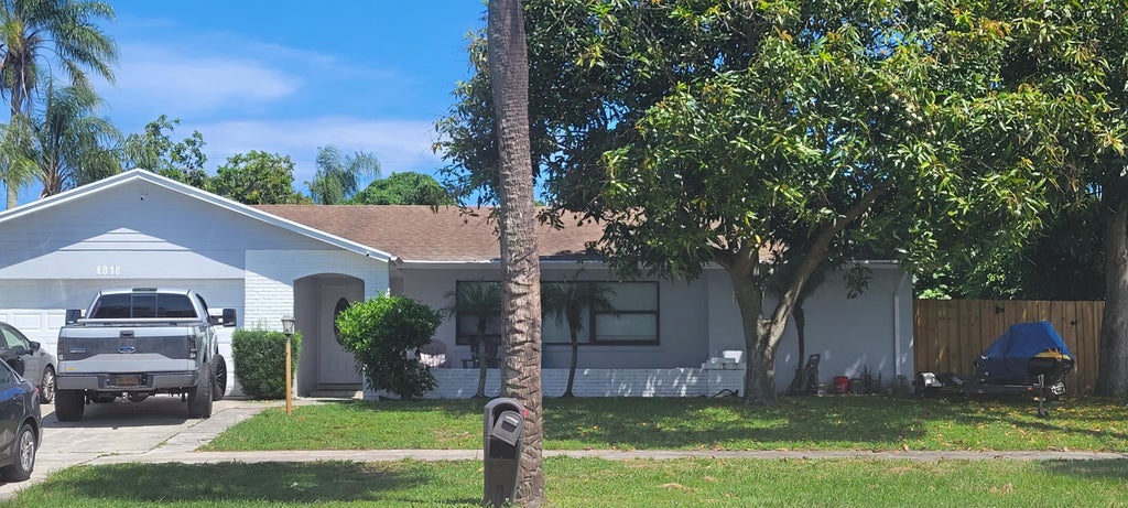 Photo of 4010 N SHORE Drive, West Palm Beach, FL 33407 (MLS # B26070250)