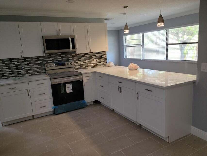 Photo of 4010 N SHORE Drive, West Palm Beach, FL 33407 (MLS # B26070250)