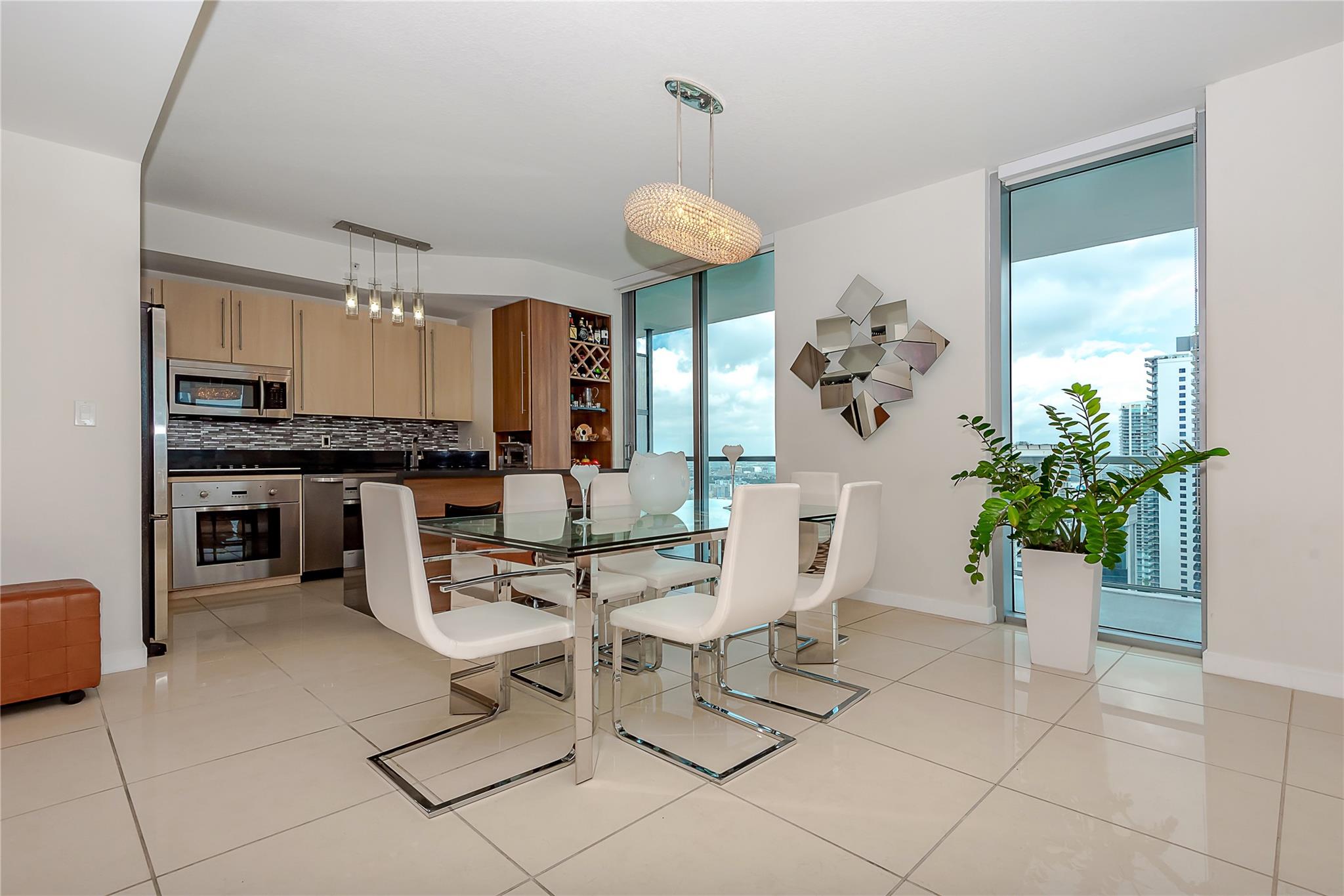 Experience unparalleled luxury in this fully renovated 3bed/3 bath unit in the heart of Brickell. High ceilings w/panoramic glass windows extending from floor to ceiling. Unit offers a wraparound balcony w/water & city views, accessible from every room. Tile flooring throughout & layout designed for optimal comfort & style. Features separate laundry room w/laundry tub. Upscale building w/amenities (modern fitness center, relaxing spa, infinity pools, kids’ clubroom, business center, BBQ areas). 2 assigned parking spaces. Convenient location, walking distance to Mary Brickell Village, Brickell City Centre and the Brickell Financial District in just minutes. Live in luxury and style in this exceptional Brickell apartment!