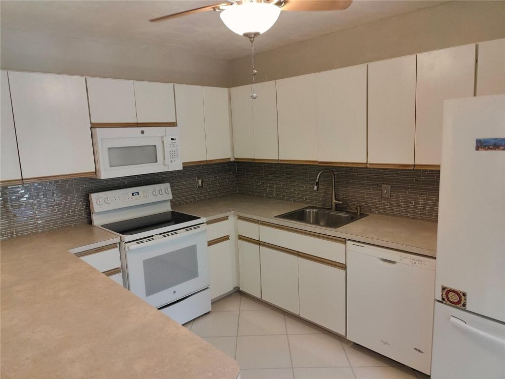 Photo of 711 NW 25th Avenue #D, Delray Beach, FL 33445 (MLS # F10461925)