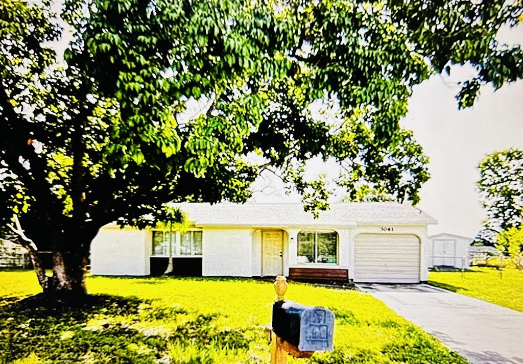 Photo of 3061 SW Blout Ct, Port Saint Lucie, FL 34953 (MLS # R10977785)