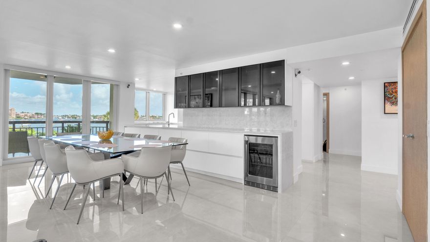 Step into refined elegance with this fully renovated waterfront condo offering sweeping views of Lake Boca. Every detail of this 2,430 sq. ft. residence was meticulously crafted using premium materials imported from Italy. Highlights include 48-inch porcelain tiles, white oak chevron floors, marble countertops, and a custom kitchen with Thermador appliances and a hidden coffee station. All doors, trim, fixtures, and built-ins are custom-designed, with impact glass and motorized blackout shades throughout. The Carlton features a newly updated lobby, 24-hour doorman, fitness center, pool, and Pickleball & Tennis Courts are Coming Soon as well as a dockside BBQ and Outdoor Kitchen! This is a prime location just steps from the beach and the World Famous Boca Raton Resort & Golf Club.