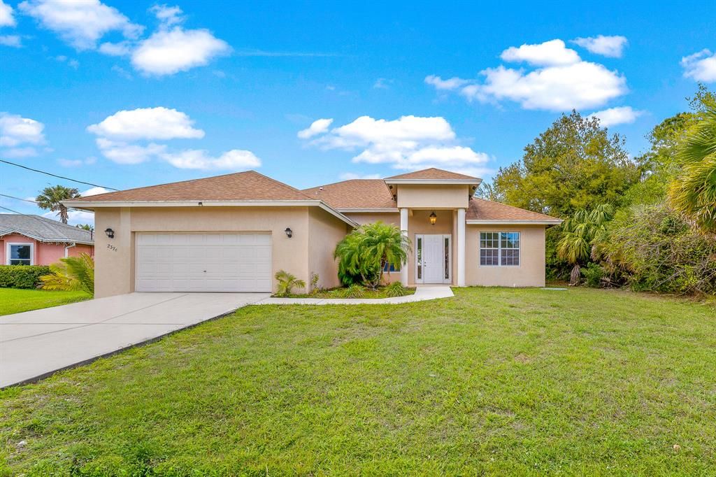 Photo of 2374 SW Blaine Terrace, Port Saint Lucie, FL 34953 (MLS # R10699057)