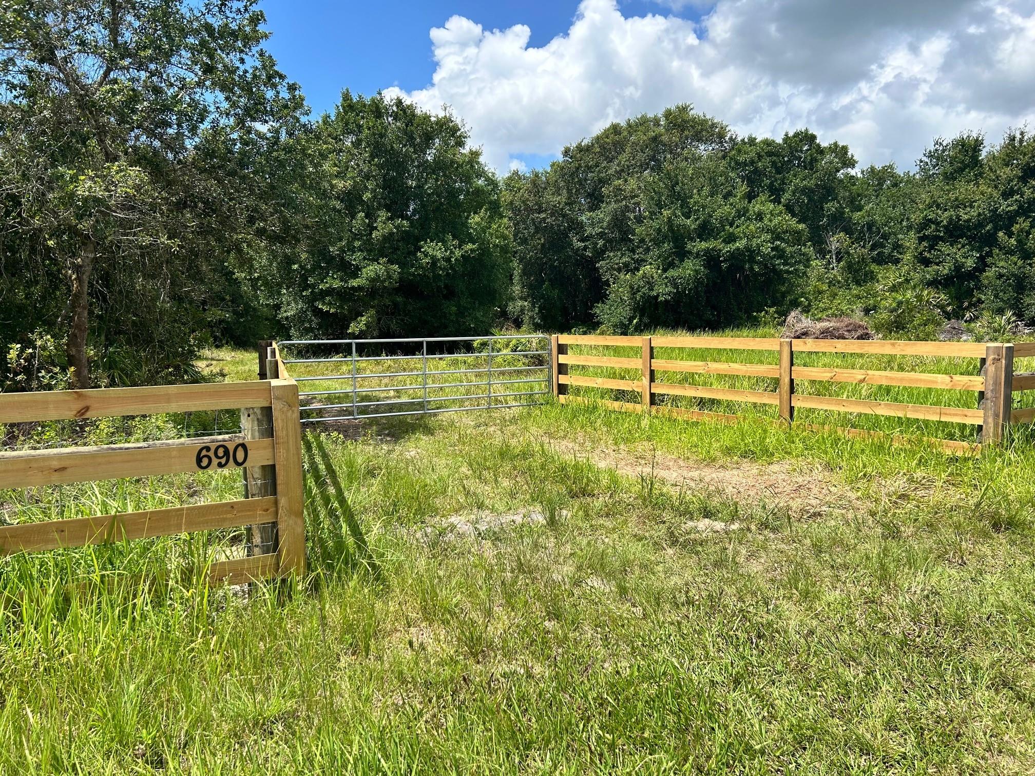 Beautiful, heavily wooded 5+/- acre buildable tract located approximately 9 miles North of the city of Okeechobee. This property has a newly constructed perimeter fence with a nice recessed board fence entrance.
