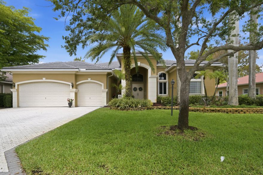 Located in highly desirable Fox Ridge, this 5BR/4BA home w/ a 3-car garage offers space, functionality, and effortless South Florida living. A NEW ROOF (& accordion hurricane shutters) provides peace of mind, while volume ceilings and an abundance of windows create a bright, open, and airy interior. The triple split floor plan offers privacy and flexibility, complemented by generously sized rooms, new bedroom flooring, and fully renovated secondary bathrooms. Step outside to a screened lanai overlooking a private backyard oasis w/ a heated pool, lush landscaping, and an outdoor grill - perfect for entertaining or relaxing. Fox Ridge offers a private amenity island w/ brand new tennis courts, playground, volleyball & walking paths. Low HOA and walking distance to A-rated schools! 5th Bedroom doesn't have a closet, but one could be added (does have an accommodating full bathroom).