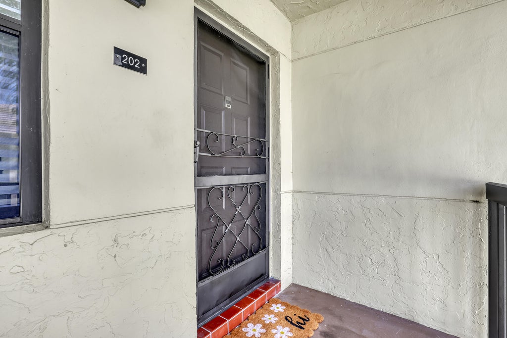 Photo of 7690 Tahiti Lane #202, Lake Worth, FL 33467 (MLS # B26077281)