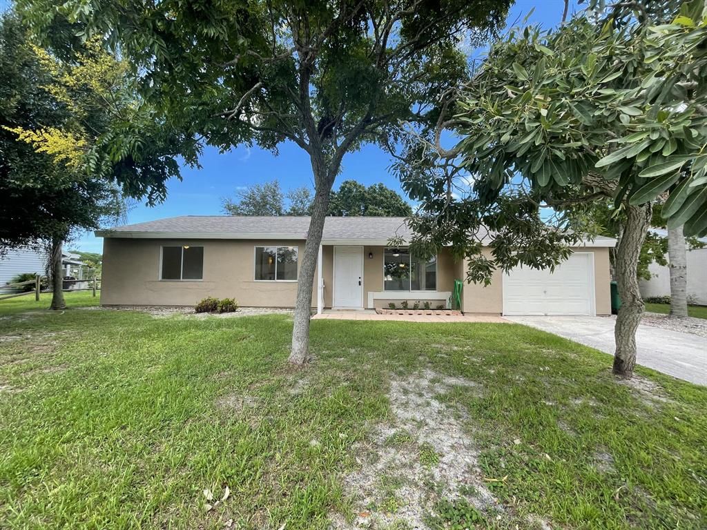 Photo of 1709 SE Burgundy Lane Ln, Port St Lucie, FL 34952 (MLS # R10746506)