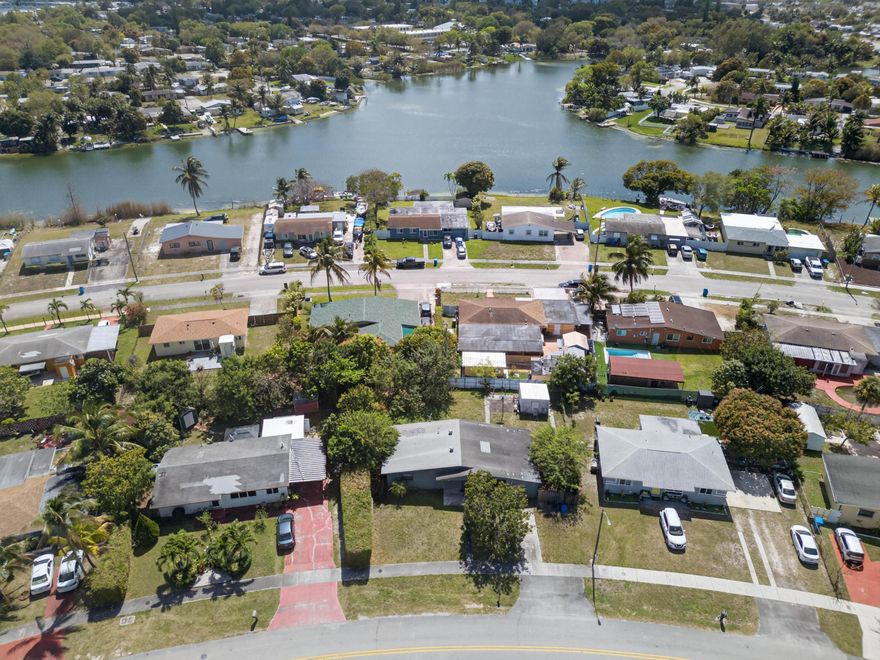 Spacious home offering incredible potential for homeowners or investors alike! The generous layout features 3 bedrooms, large living areas, & a bright kitchen with abundant cabinet space & room for a full dining setup. Tile flooring throughout main areas for durability & easy maintenance, while expansive bedrooms offer flexible space for guests, office setups, or multigenerational living. The fenced backyard provides plenty of room for entertaining, pets, or future upgrades. Situated in a convenient S Broward location with easy access to I-95, the Turnpike, & major commuter routes. Close to shopping, dining, parks, and everyday conveniences including Hard Rock Stadium & Casino, Gulfstream Park, and Aventura area retail.  A solid property with great bones ready for value adding improvements