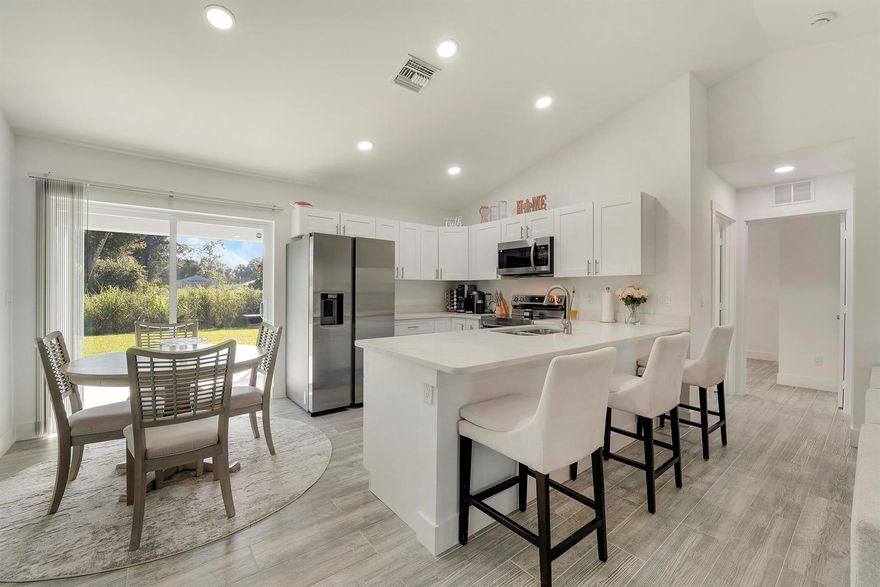 Welcome to this new and move-in ready home, offering modern finishes and thoughtful design throughout. Featuring 3 bedrooms and 2 bathrooms, this split floor plan includes elegant granite countertops, ceramic tile flooring, and energy-efficient impact windows, doors, and sliders.Situated on nearly a 1/4-acre lot, the property offers a wide 4-car concrete driveway and covered front and back porches, perfect for outdoor enjoyment and entertaining. With NO monthly HOA fees, homeowners can enjoy more flexibility and lower carrying costs.Additional features include a water softening system and a 10-year structural warranty, providing extra peace of mind for the new owner.