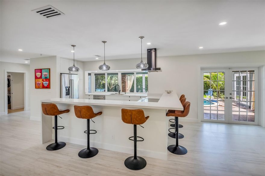 Fully renovated, stunning home in the heart of Fort Lauderdale! Best Priced Home in prestigious Coral Ridge Country Club. Perfect for a family to enjoy the Florida lifestyle near best schools. 4 Bedrooms + Office and 2 Bathrooms. Lush landscaping throughout with pineapples and olive tree. Salt-water Heated Large pool. Fully furnished by West Elm. Custom kitchen top tier appliances and generous cabinetry for plenty of storage. Impact windows and doors. Home is powered by 40 Solar panels that run the entire home & 50 Amp Electric vehicle outlet, full insulation. Electric golf cart is negotiable. All appliances are under warranty. Qualified buyers can get a 4.78% interest rate.