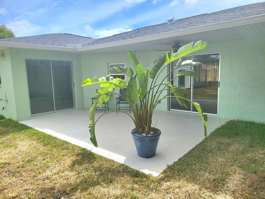 Photo of 869 SE Odonnell Lane, Port Saint Lucie, FL 34983 (MLS # R10976869)