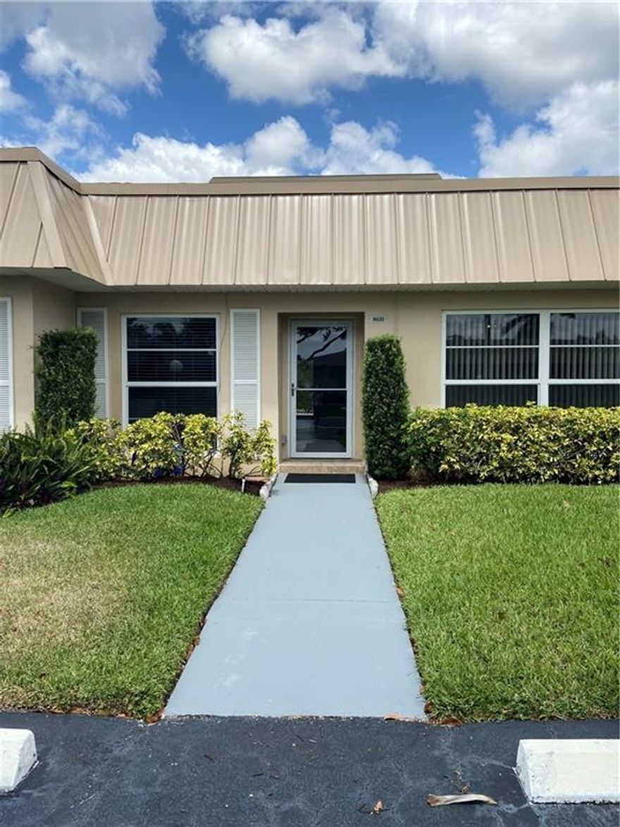 Move right into this beautifully updated water view unit.  Enjoy this prime location in Boca Lakes while sitting on the outside patio overlooking the water. Everything has been updated!  All new hurricane windows and doors , new roof,  new electrical panel. Water , garbage, exterior maintenance and extended cable package and man gated security all included in your monthly fees. Den can be converted to 2nd bedroom Enjoy the recently updated amenities of this conveniently located 55+ active community. Close to shopping, Turnpike and I 95