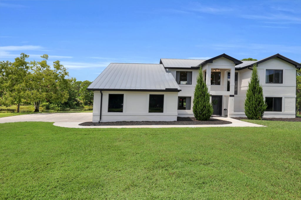 Photo of 9809 SW MALIBU Terrace, Palm City, FL 34990 (MLS # B26077151)