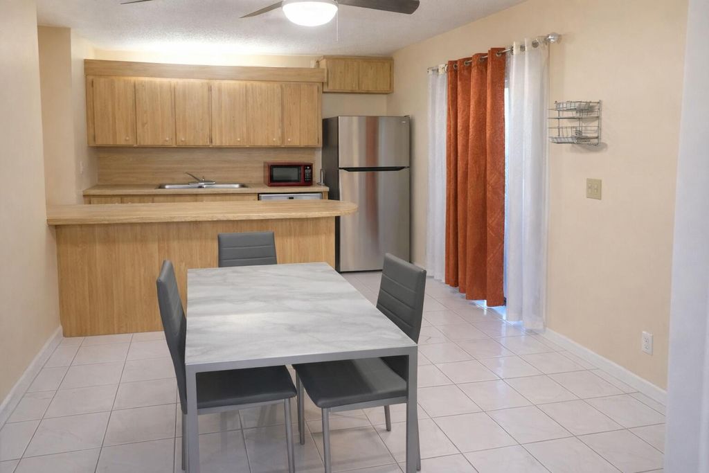 Photo of 211 Woodland Road, Palm Springs, FL 33461 (MLS # R11158826)