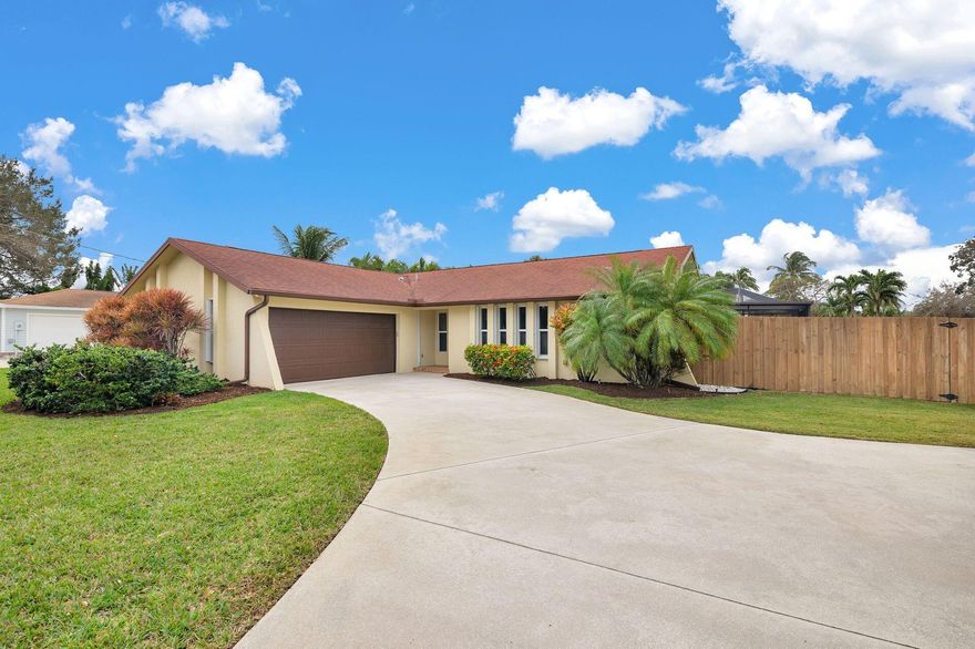 Welcome home to your new move-in ready Tequesta address. Located in the heart of the community, this exceptional home sits on 1/3 of an acre corner lot with a circular drive.  It offers 3 bedrooms, 2 full updated baths, a spacious kitchen, screened in heated pool/spa and a fully fenced and private back yard.  The air conditioned garage has  matted flooring with plenty of room for both cars.  An additional custom tool shed offers more space for your yard tools. This CBS constructed home is protected with impact windows and accordion shutters too! Easy stroll to coffee shops, restaurants and shopping with world class golfing and fishing nearby and 25 minutes to Palm Beach international airport.