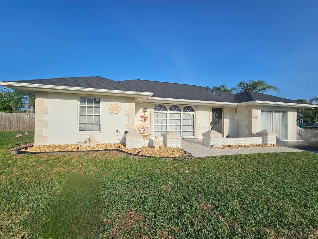 Photo of 333 NE Surrey Street, Port Saint Lucie, FL 34983 (MLS # R11092157)
