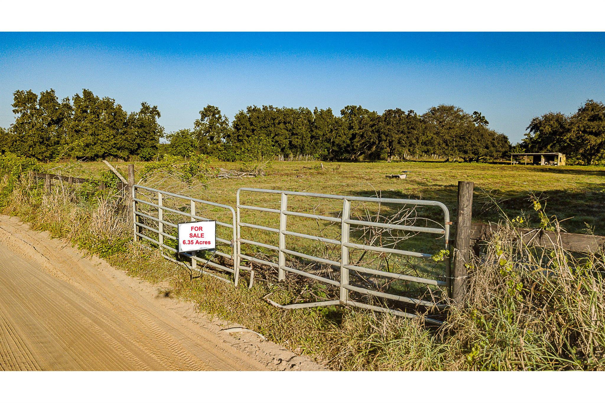 Come checkout this great property. It's 6.35 Acres, fenced & private needs a little TLC!, Build, farm, set up a business or a camp and build your dream. It's some of the last open areas of Palm Beach County. This area was a very large orange grove, ''Santa Rosa Groves''. Don't miss your chance at 6 acres of paradise. Be aware that 4 young bulls live on the property.