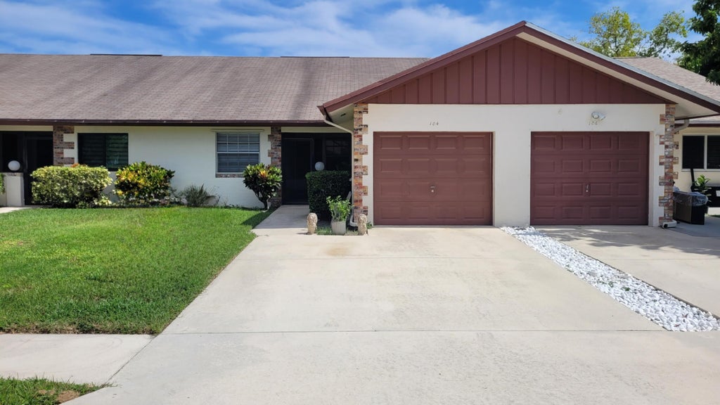 Photo of 104 Moccasin Trail S, Jupiter, FL 33458 (MLS # R11114595)