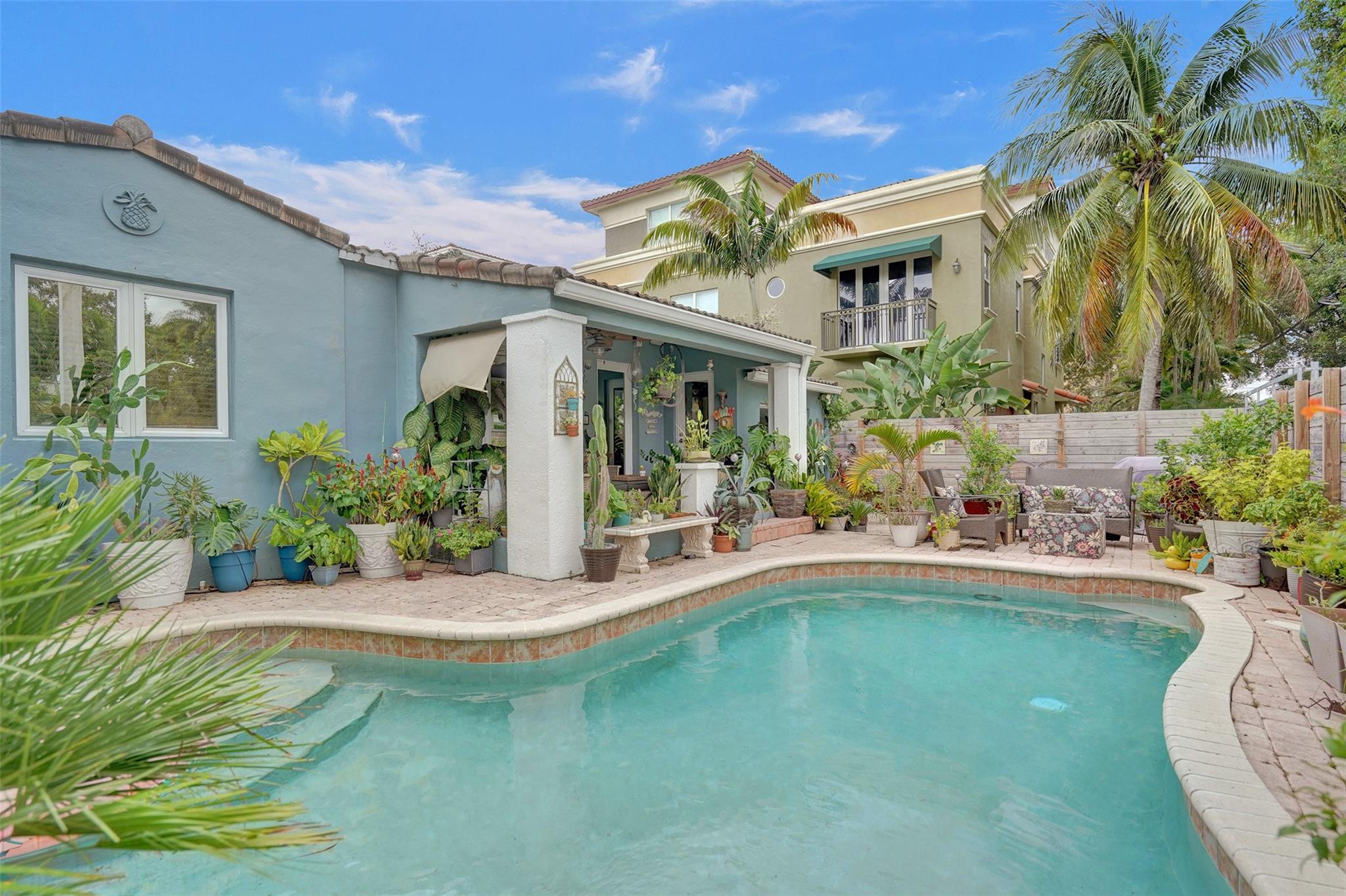 Location, location, location! Look no further for South Florida tropical charm than this 2 BED/2 BATH Victoria Park bungalow. An ideal home for anyone seeking a small footprint with minimal upkeep in the heart of downtown. Harwood and vinyl floors throughout. Updated lighting, fresh paint, newer AC and additional storage area. Separate living and dining areas. Natural gas from the street services kitchen range, water heater, and dryer. Spacious walk-in shower in master bathroom complete with dual sink vanity added. Impact windows/doors throughout. Private pool with extra sun throughout the day. Bonus Florida room off the kitchen makes the perfect home office, man cave, or den. Separate utility/storage room. Minutes to Las Olas and Fort Lauderdale Beach.