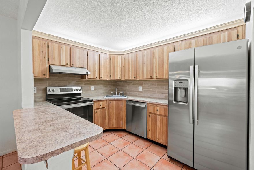 $99,000 with low HOA (~$314.96/month) . Turnkey end-unit condo offering added privacy and abundant natural light. Features include a new roof (2024), new A/C (2024), and brand-new appliances, along with an updated kitchen and bathroom—completely move-in ready. Enjoy a private balcony and a peaceful setting ideal for comfortable living. HOA covers cable and exterior maintenance, providing added convenience and value. Centrally located near shopping, dining, medical offices, and everyday essentials—perfect for an easy, active lifestyle. Located in a 55+ community. All information on the MLS for this listing is deemed reliable but not warranted or guaranteed and subject to errors, omissions & changes without notice. Buyers & agents must verify all information.