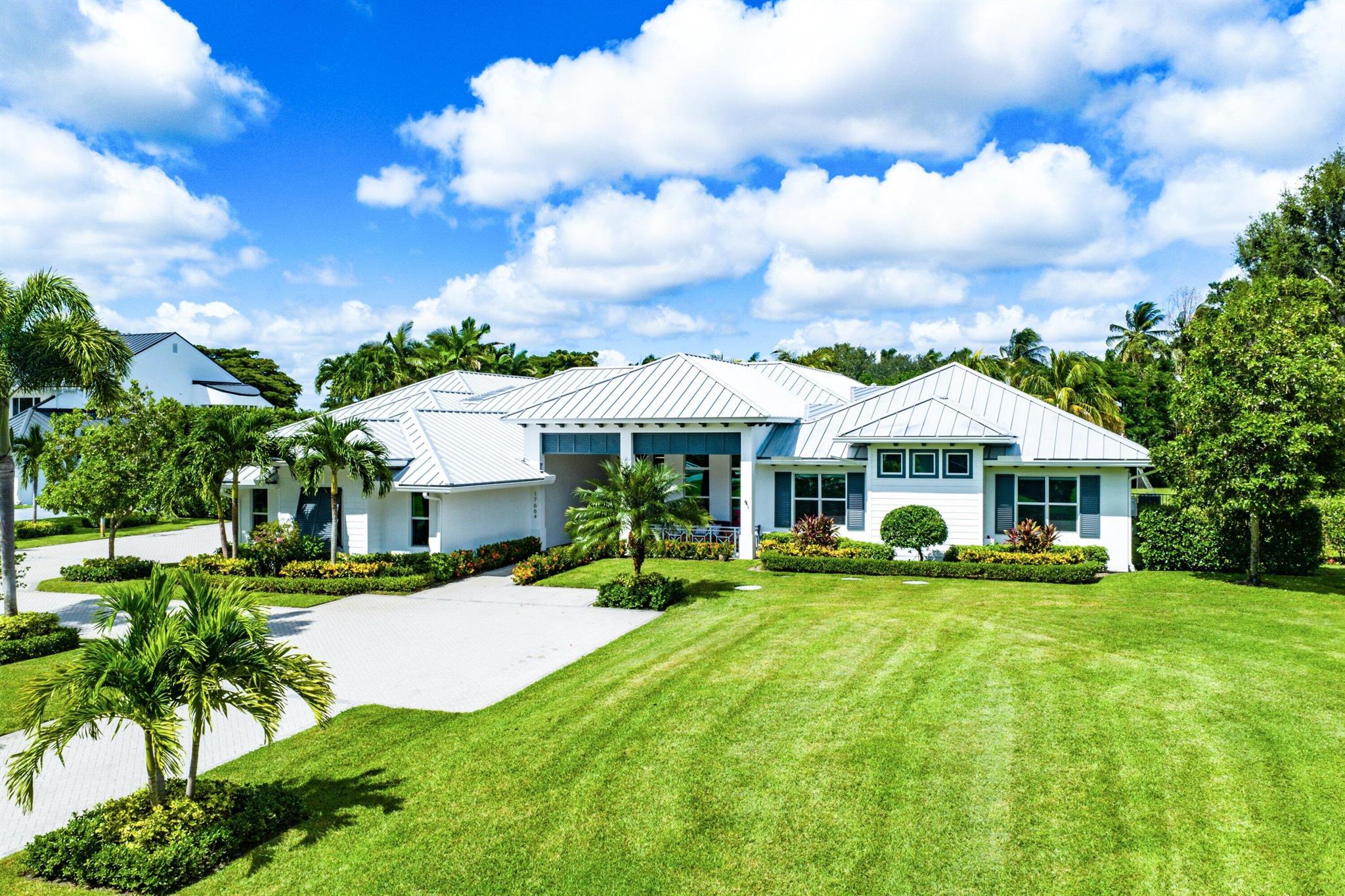 Tucked behind the gates of Fieldbrook Estates, one of Boca Raton's most exclusive communities of just 54 custom homes, this modern masterpiece sits quietly on a private one-acre lot. Completely reimagined and rebuilt in 2019, this single story residence offers 8,130 square feet under air of exceptional design and craftsmanship.The home features 7 bedrooms, 6 full and 2 half baths, along with thoughtfully curated lifestyle spaces including an office, game room with a custom bar, private theater, and a gym with a sauna. One guest suite enjoys its own living area and private entrance -- ideal for extended family or long-term guests.The interiors are bright, open, and effortlessly sophisticated -- a seamless blend of clean lines, warm textures, and natural light. The chef's kitchen is both