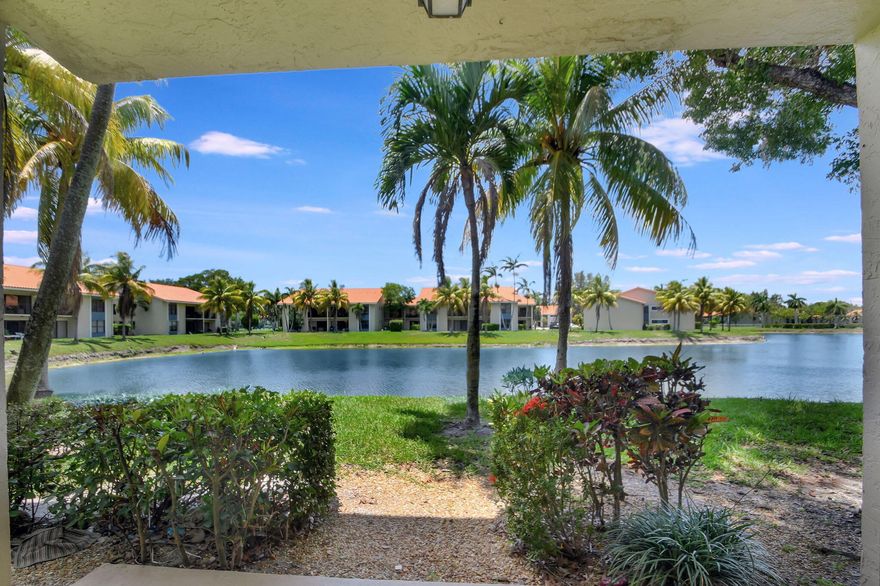 Beautifully maintained 2 bedroom 2 bathroom ground floor corner condo with serene water views! The home features an open floor plan, upgraded wood cabinetry in the kitchen and bathrooms with granite countertops, stainless steel appliances, tile flooring throughout and crown molding. The Kitchen is open to the living and dining area with sliding glass doors overlooking and expansive waterfront allowing for an abundance of natural light and unobstructed water views. The home also features a washer and dryer for convenience. Palm Beach Grande is an all ages community with amenities including clubhouse, swimming pools, tennis and exercise room. Centrally located with an easy commute to the FL Turnpike, restaurants, schools and shopping.